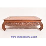 A 20th Century Chinese teak low table, t