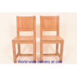 A pair of limed oak side chairs with sol