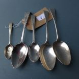 A collection of five Georgian silver spoons including two with bright cut engraving