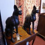 A pair of large Egyptian style bronze figures of cats seated on their hind legs