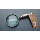 A silver plated magnifying glass with golf bag form handle