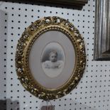 A 19th century hand tinted print portrait of a child in a good 19th century giltwood frame with