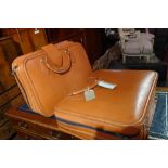 A two piece Schedoni leather Ferrari luggage set complete with original Ferrari padlocks,