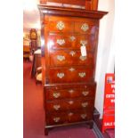 A Georgian style walnut and crossbanded chest on chest fitted arrangement of eight drawers and