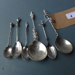 A collection of silver apostle spoons and similar including one silver plated example and one with