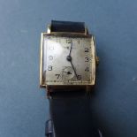 A gold Baume gentlemans wristwatch in working order