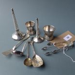 A collection of silver items including sugar nips, a sugar sifter and others,