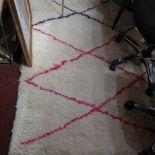 A Moroccan Beni Ourain Berber wool rug with pink and purple geometric lozenge design 310 x 205cm