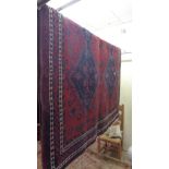 A fine north west Persian Afshar rug 240 x 155cm with repeating stylised pole medallion all over on