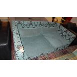 A contemporary designer two seater sofa