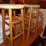 A pair of beech bar stools with rush sea