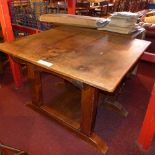 An early 20th century oak kitchen table