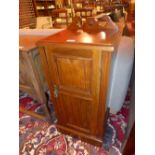 An Edwardian walnut pot cupboard fitted