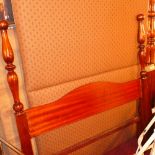 A mahogany four poster bed with turned s