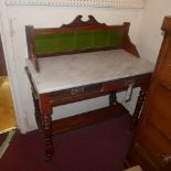 An Edwardian mahogany washstand, with a