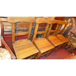 A set of 4 heavy pitch pine chapel chair