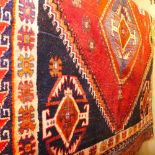 A fine south west Persian Qashgai rug 200 x 130cm bearing double pole medallion on a rouge field