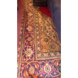 A fine north west Persian Tabriz carpet 350 x 250cm central diamond petal medallion on a rouge