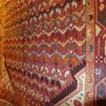 A fine north west Persian Hamadan rug 240 x 125cm central diamond medallion with repeating