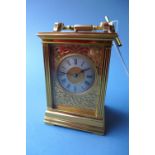 A fine quality late 19th century carriage clock striking with fretwork sides,