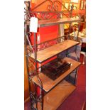 A wrought iron waterfall open bookcase and a Fleur De Lys stool