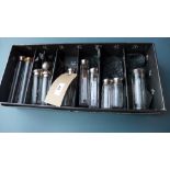 A collection of dressing table bottles, seven having hallmarked silver lids, mainly Victorian,