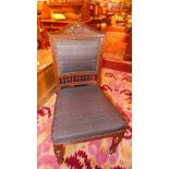 A set of six oak studded pad seat and back dining chairs on reeded supports