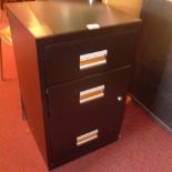 A pair of black painted metal filing cab