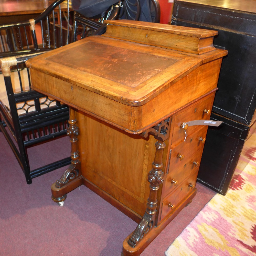 A Victorian walnut Davenport with four d