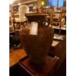 A large Oriental vase, having many handl
