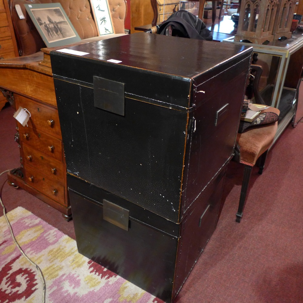 A pair of Chinese black lacquered trunks