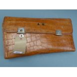 A crocodile skin cased vanity set with h