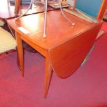 A 1960's Danish teak circular drop leaf