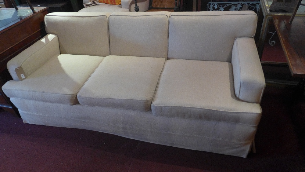 A contemporary three seater sofa upholst