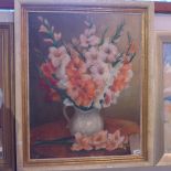 A framed oil on canvas of flowers signed