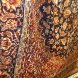 A Keshan style carpet having a floral me