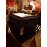 A small leather cube shaped footstool, 5