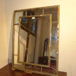 An antique gilt gesso wall mirror of a r