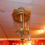 A large brass hanging lantern, the top w