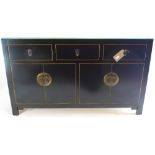 A contemporary Chinese black lacquered sideboard H 85 x W 132 x D 34cm