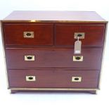 A 19th century mahogany and brass bound campaign chest of two short over two long drawers H 27 x W