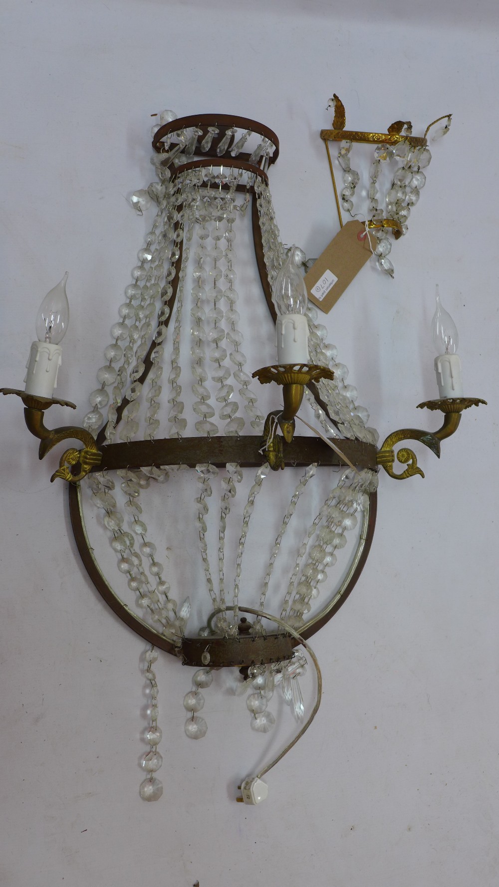 A gilt metal three branch wall sconce decorated with lustres H 80 x W 60 x D 35cm together with a