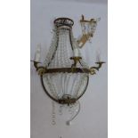 A gilt metal three branch wall sconce decorated with lustres H 80 x W 60 x D 35cm together with a