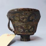 A Chinese libation cup carved with mythical creatures,