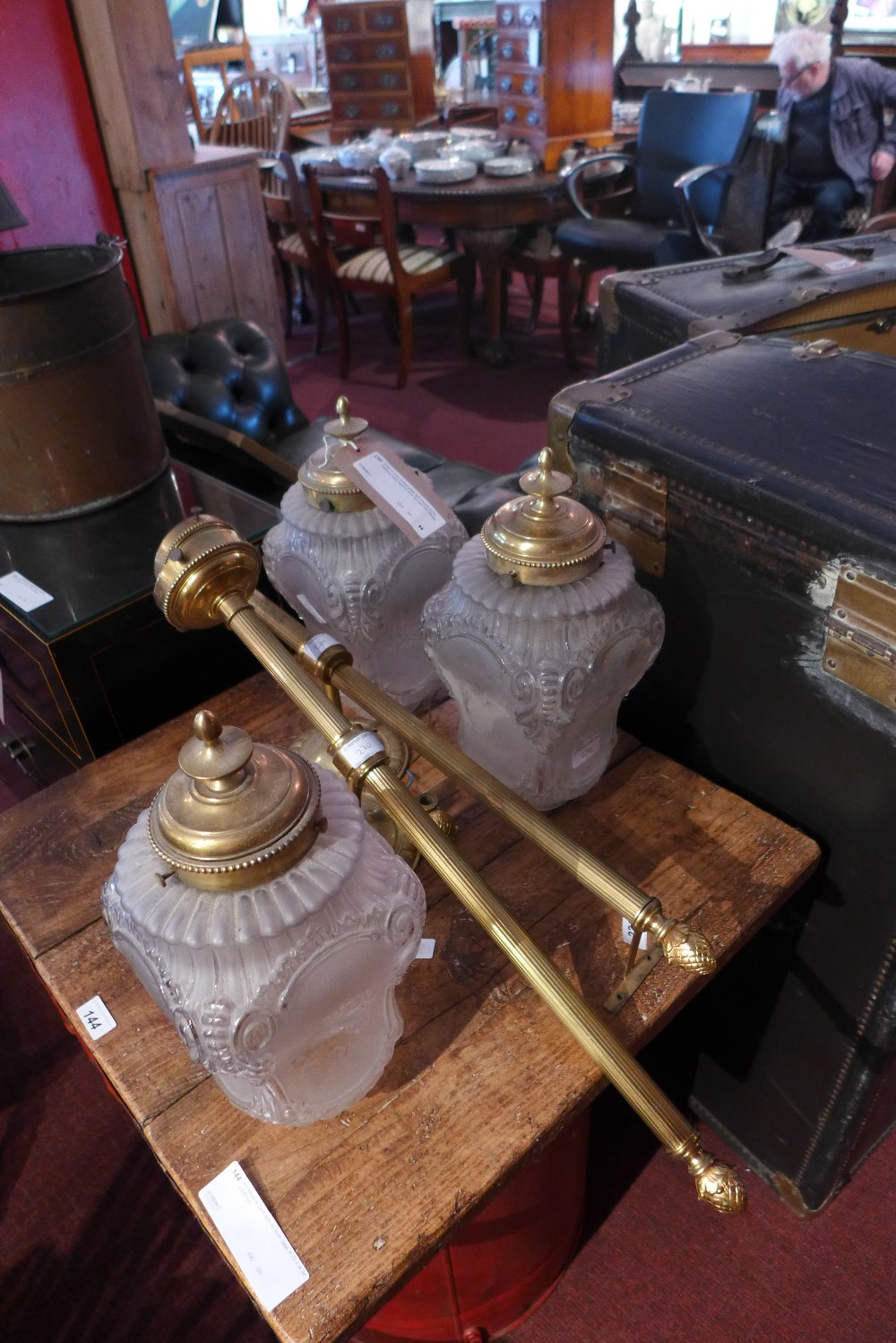 A set of three frosted glass light shades in the classical taste together with two wall light