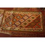 A fine south west Persian Qashgai Kilim 277 x 145cm with repeating diamond stamped medallion on a
