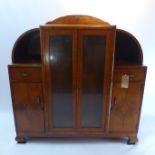 An Art Deco burr walnut display cabinet with two glazed doors flanked by two single drawers above