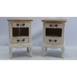 A pair of French oak white painted bedside chests having two drawers and a recess,