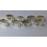 A set of eight hallmarked sterling silver napkin rings of oval form decorated with elephants