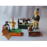 Three cast iron money boxes to include Uncle Sam,